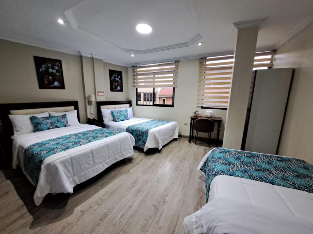 Postel nebo postele na pokoji v ubytování Hotel Virgen del Cisne