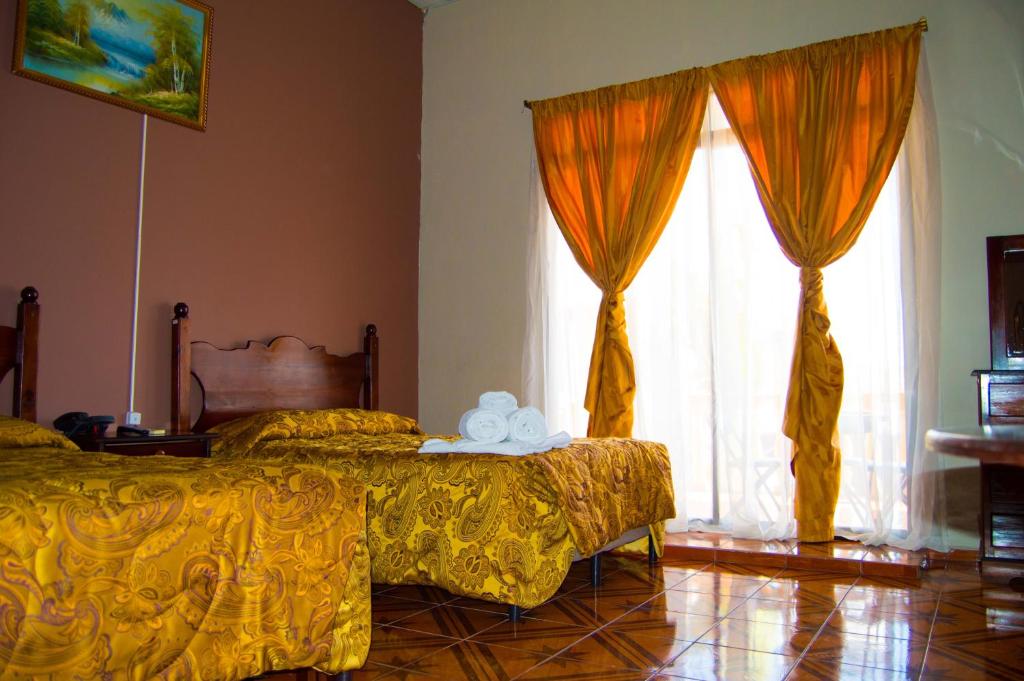 Postel nebo postele na pokoji v ubytování Hotel Antigua Comayagua