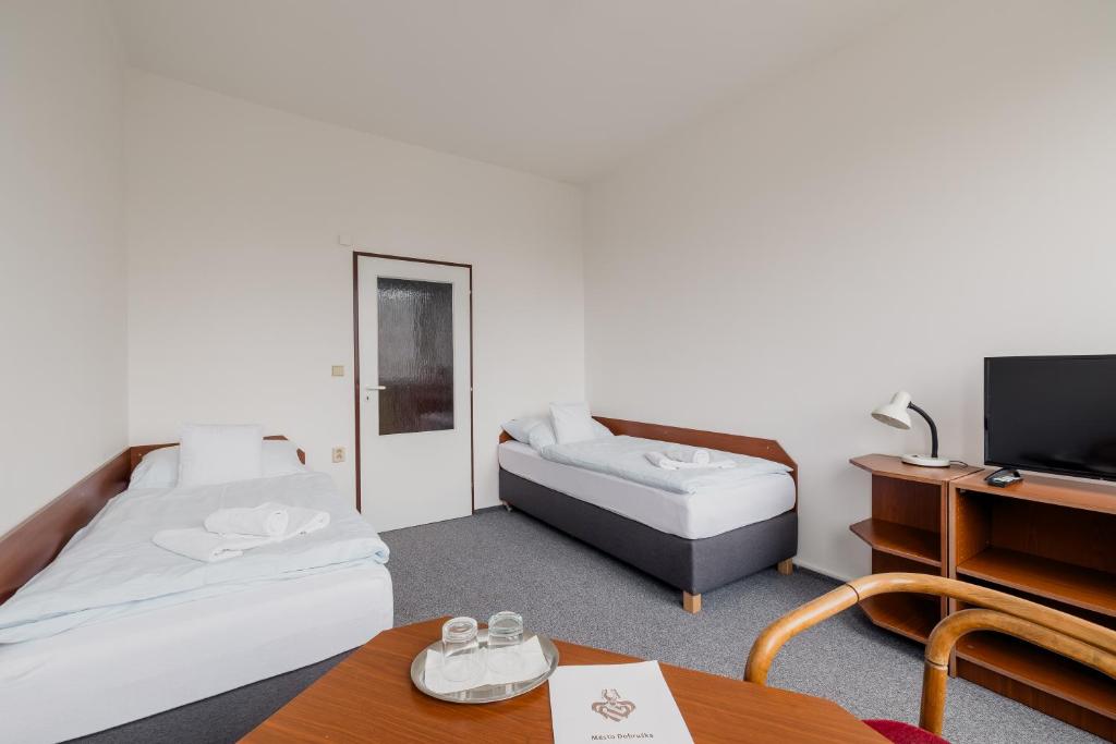 Postel nebo postele na pokoji v ubytování hotel Dobruška