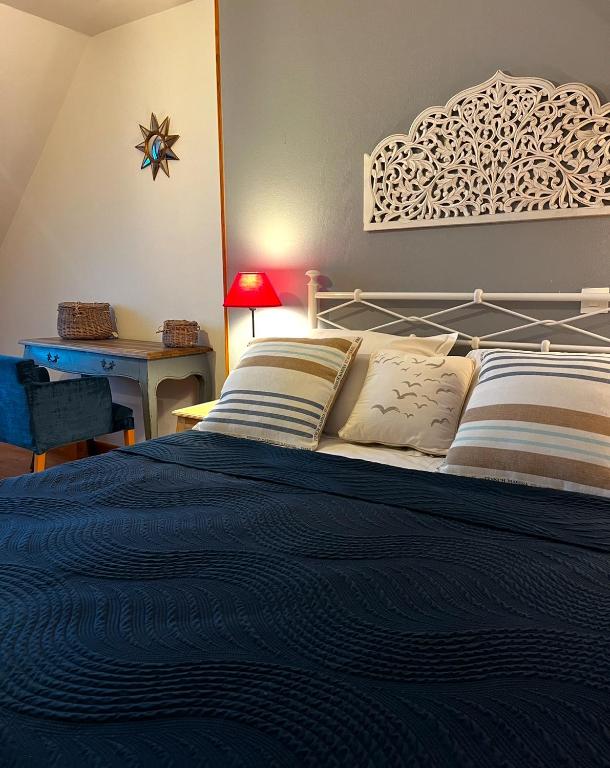 Postel nebo postele na pokoji v ubytování Les Transats Chambre et appartements Face à la mer