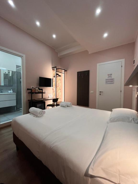 Postel nebo postele na pokoji v ubytování Colosseum Deluxe