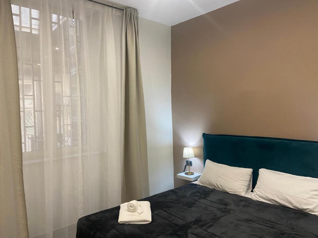 Posteľ alebo postele v izbe v ubytovaní Doria Suites Napoli