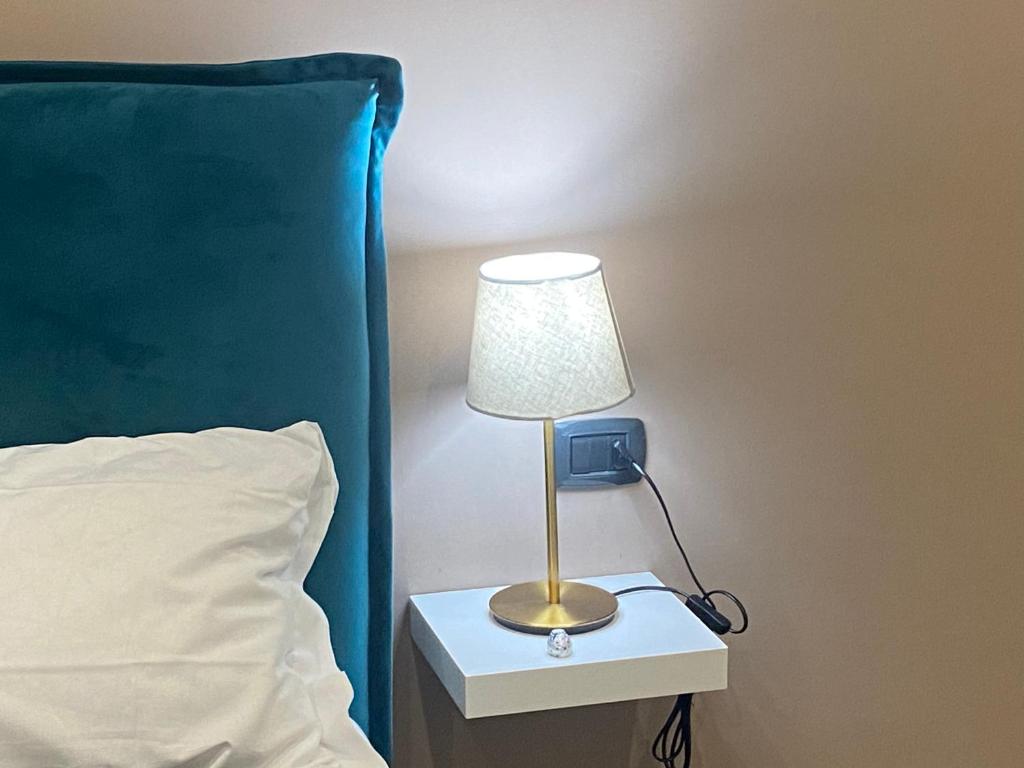 Posteľ alebo postele v izbe v ubytovaní Doria Suites Napoli