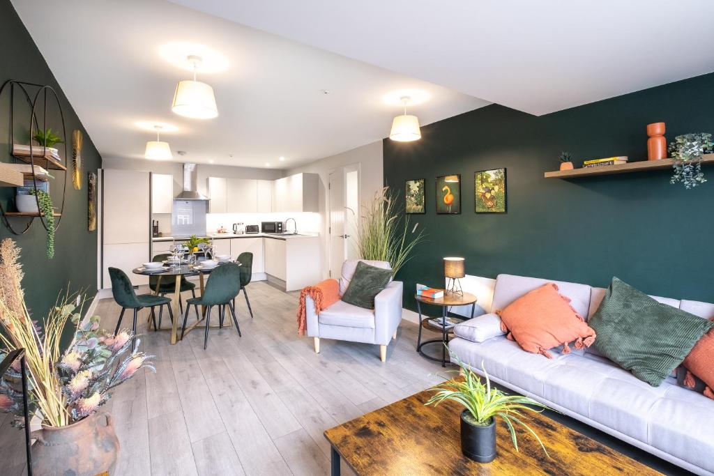a living room with a couch and a table at Premium CITY Apartment in Hemel Hempstead