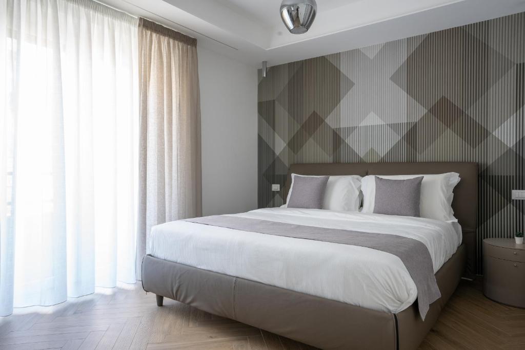 Postel nebo postele na pokoji v ubytování Hezio Guest House