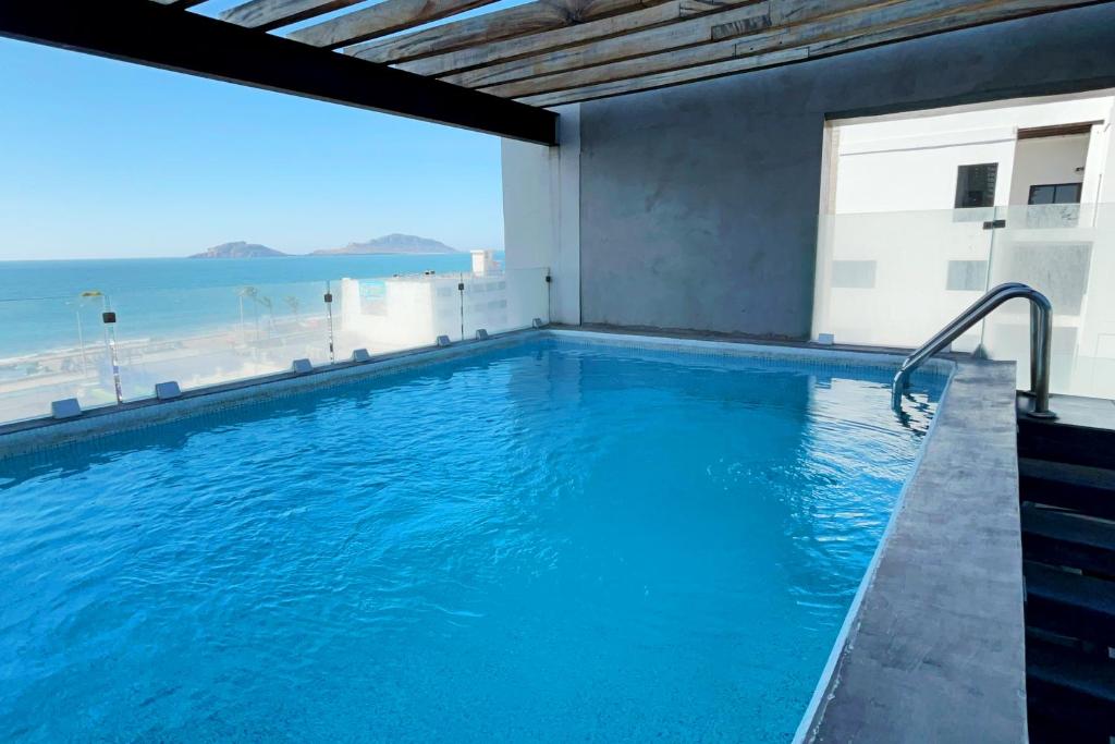 Bazén v ubytování Paraíso Costero con Vista al Mar nebo v jeho okolí