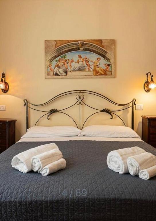 Postel nebo postele na pokoji v ubytování B&B Ares Charme