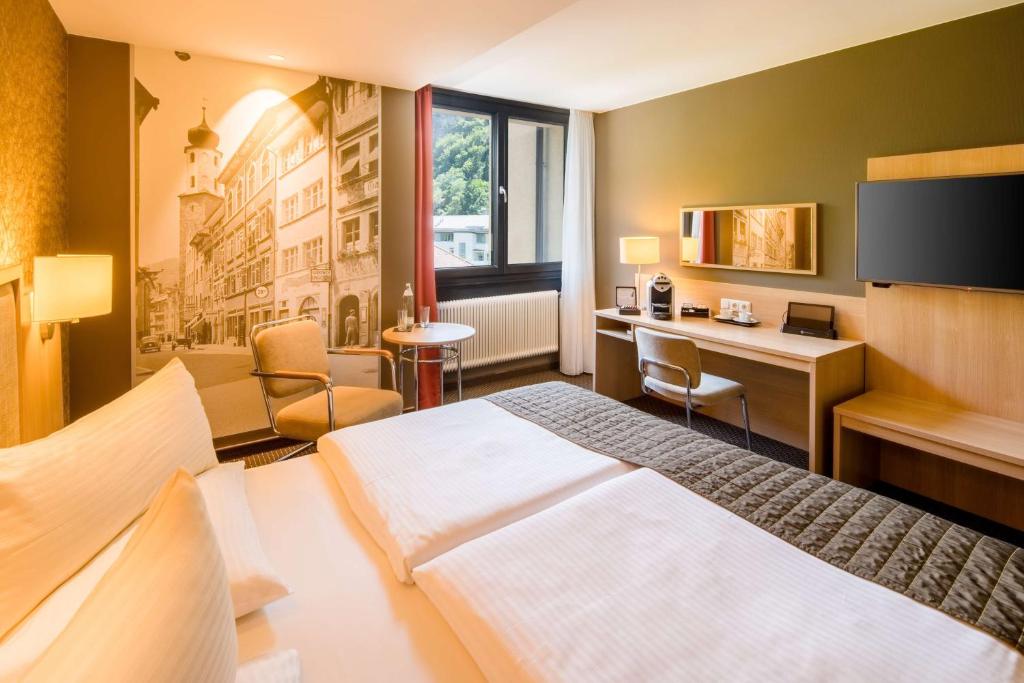 Postel nebo postele na pokoji v ubytování Best Western Premier Central Hotel Leonhard
