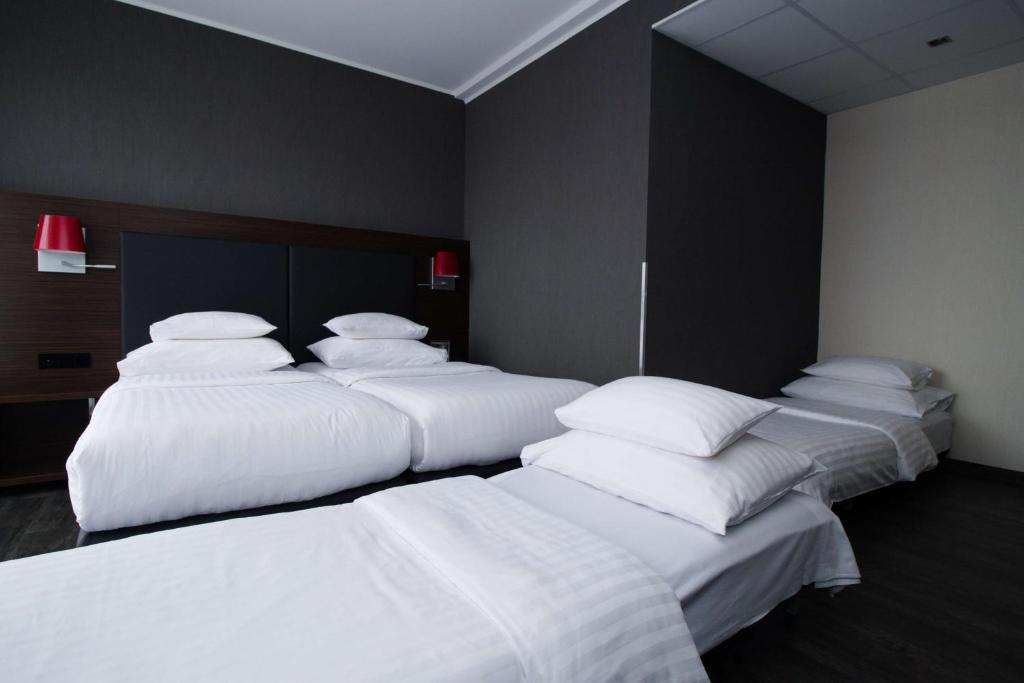 Een bed of bedden in een kamer bij Best Western Plus Plaza Hotel Graz