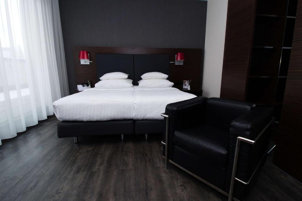 Een bed of bedden in een kamer bij Best Western Plus Plaza Hotel Graz