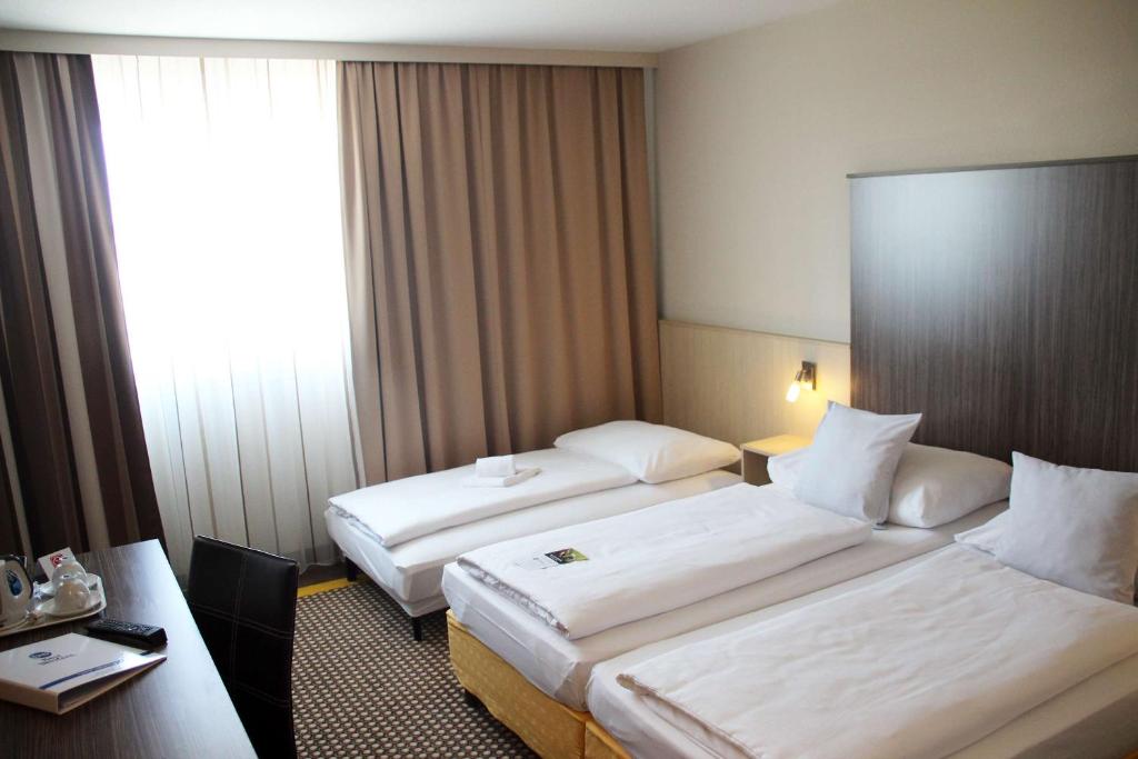 Postel nebo postele na pokoji v ubytování Best Western Smart Hotel