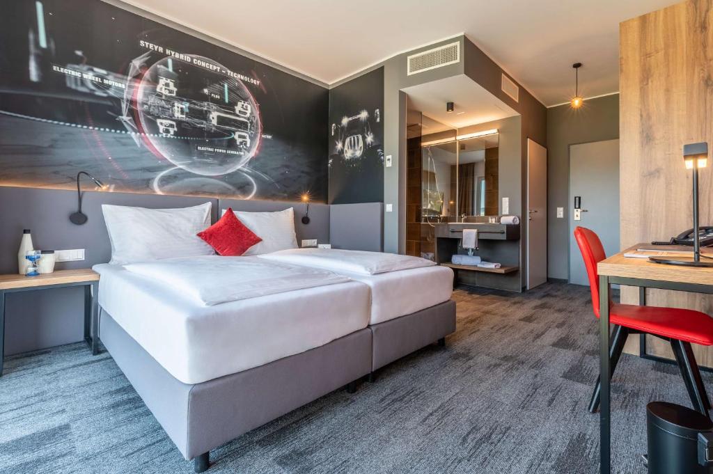 Postel nebo postele na pokoji v ubytování Aiden by Best Western Stadtgut Hotel Steyr - FREE PARKING