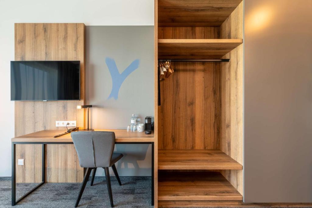 TV a/nebo společenská místnost v ubytování Aiden by Best Western Stadtgut Hotel Steyr - FREE PARKING