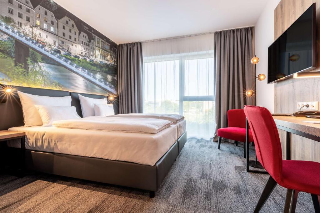 Postel nebo postele na pokoji v ubytování Aiden by Best Western Stadtgut Hotel Steyr - FREE PARKING
