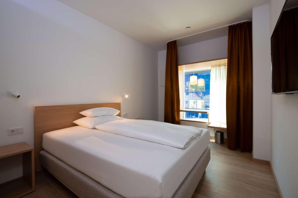 Voodi või voodid majutusasutuse Best Western Hotel Spinnerei Linz toas