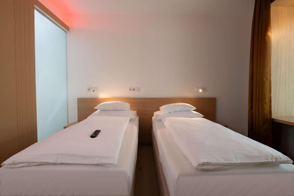 Voodi või voodid majutusasutuse Best Western Hotel Spinnerei Linz toas