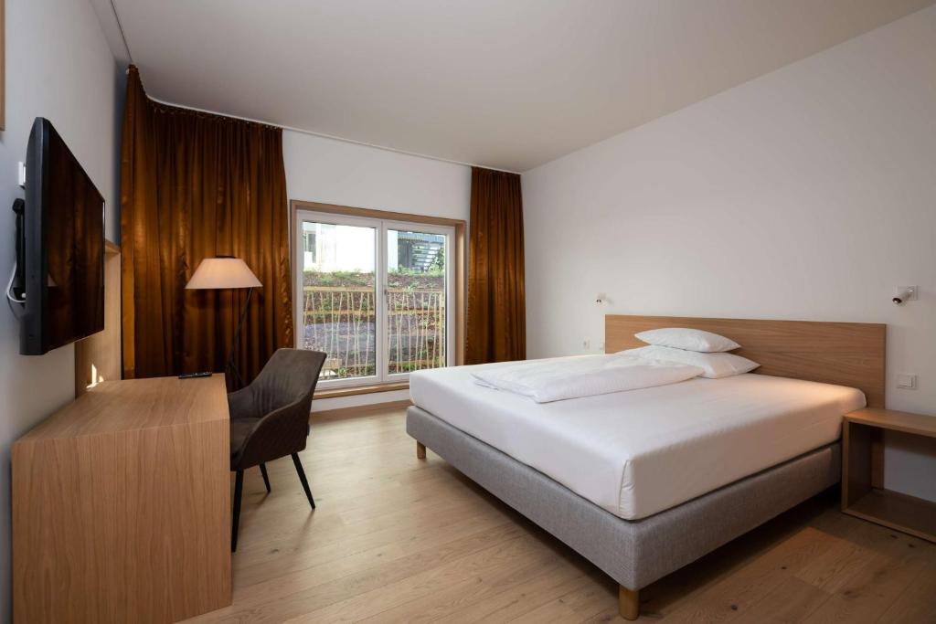 Voodi või voodid majutusasutuse Best Western Hotel Spinnerei Linz toas