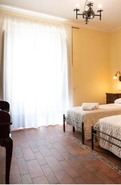 Postel nebo postele na pokoji v ubytování B&B Ares Charme