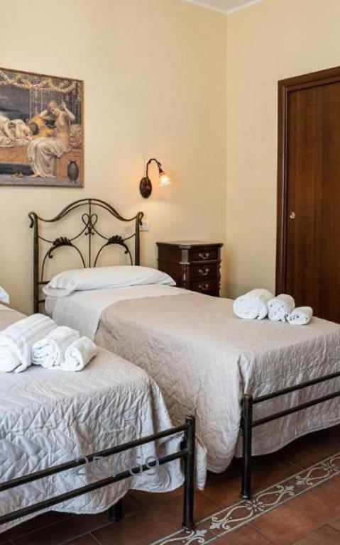 Postel nebo postele na pokoji v ubytování B&B Ares Charme