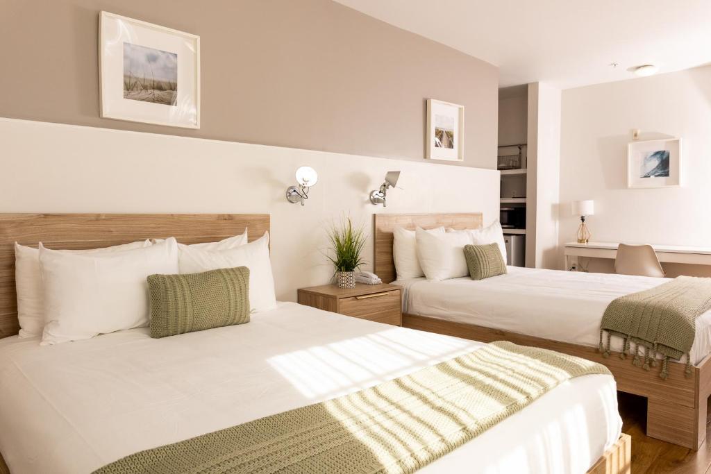 Postel nebo postele na pokoji v ubytování Riviere South Beach Hotel