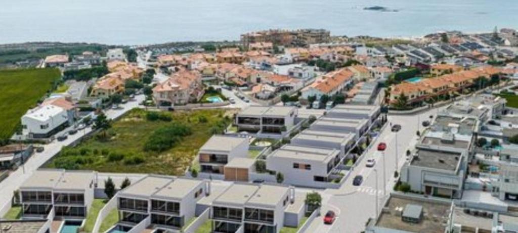 an aerial view of a city with white buildings at Mãe Maria House Pilgrims Santiago in Vila Chã