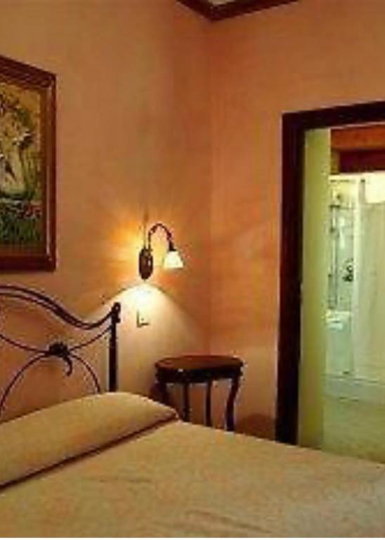 Postel nebo postele na pokoji v ubytování B&B Ares Charme