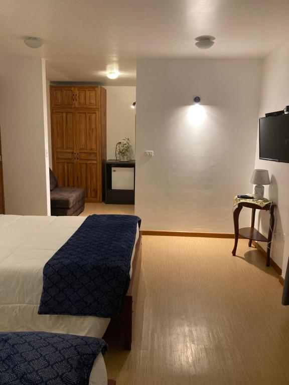 Postel nebo postele na pokoji v ubytování Apricot Hotel