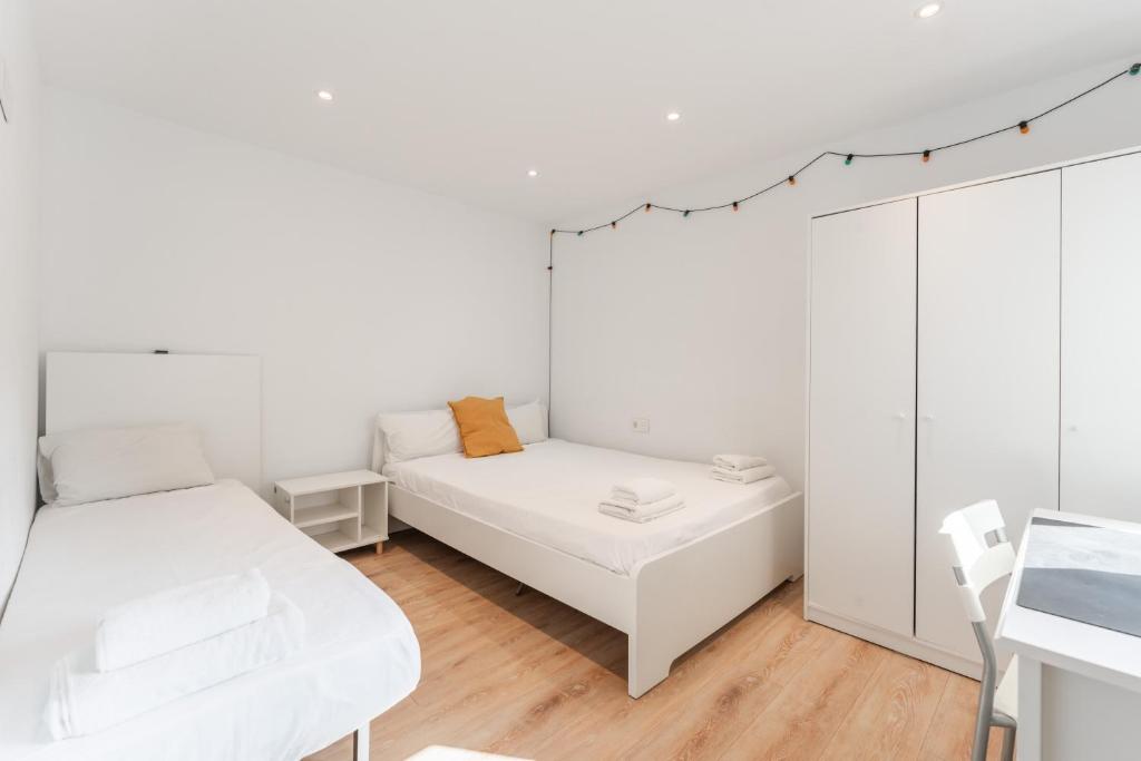 Postel nebo postele na pokoji v ubytování Feel Welcome Barcelona Smart flat