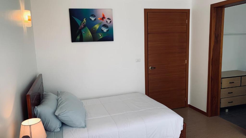 Postel nebo postele na pokoji v ubytování Apricot Hotel