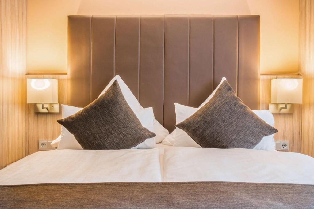 Postel nebo postele na pokoji v ubytování Best Western Plus Hotel Regence