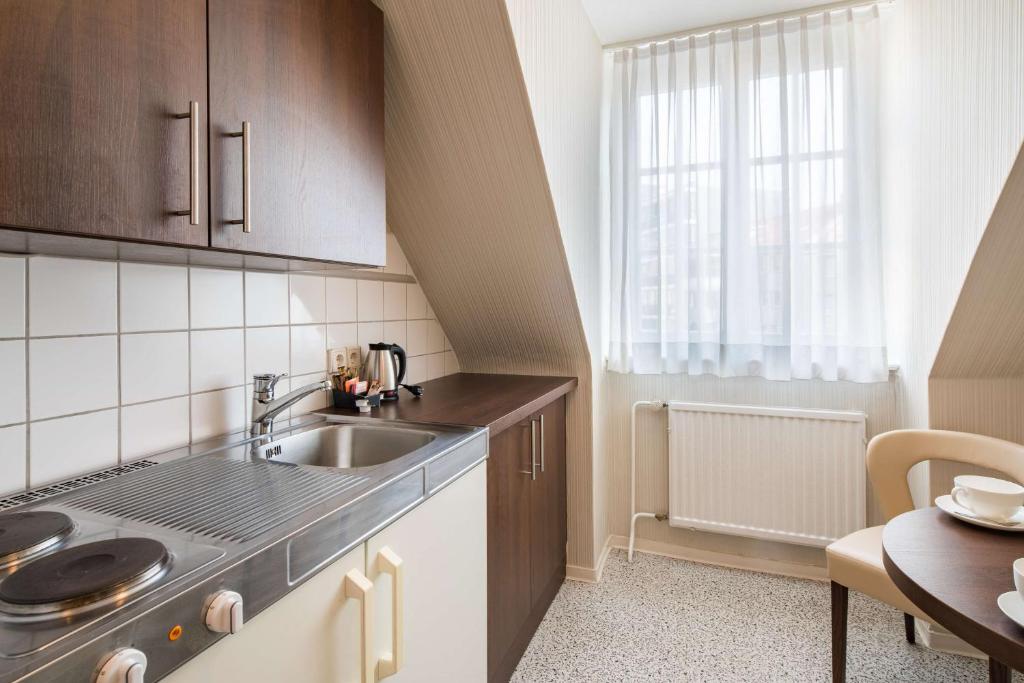 Kuchyň nebo kuchyňský kout v ubytování Best Western Plus Hotel StadtPalais
