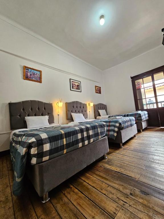 Postel nebo postele na pokoji v ubytování Cusco el Conquistador