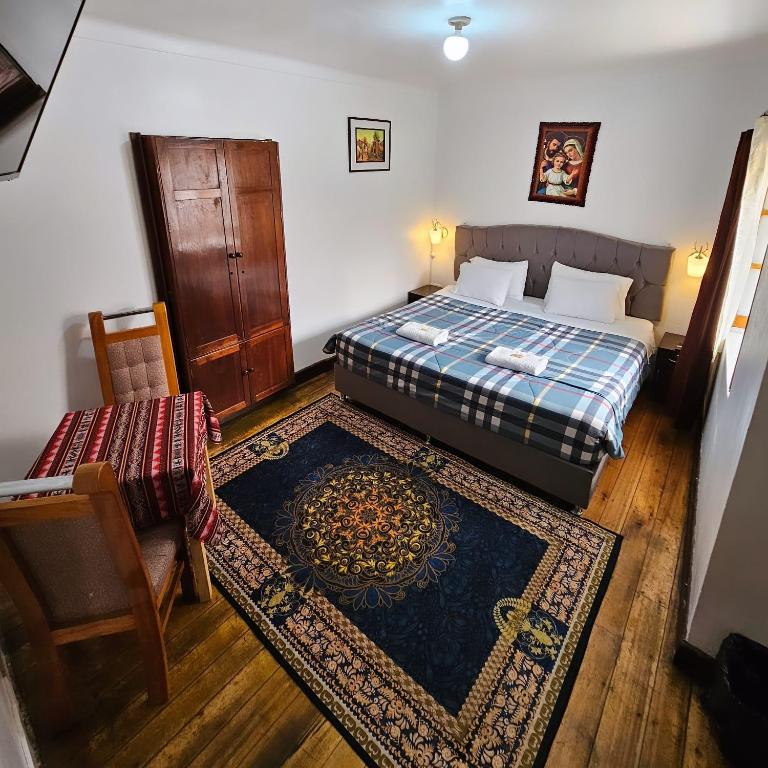 Postel nebo postele na pokoji v ubytování Cusco el Conquistador