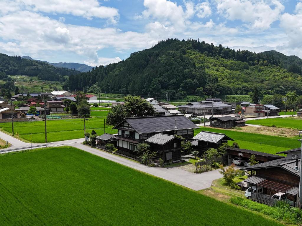 an aerial view of a town with a mountain at 板倉の宿 白栗 in Takayama