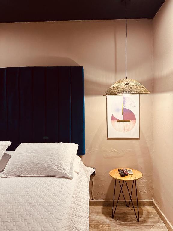 Postel nebo postele na pokoji v ubytování Hotel Londres