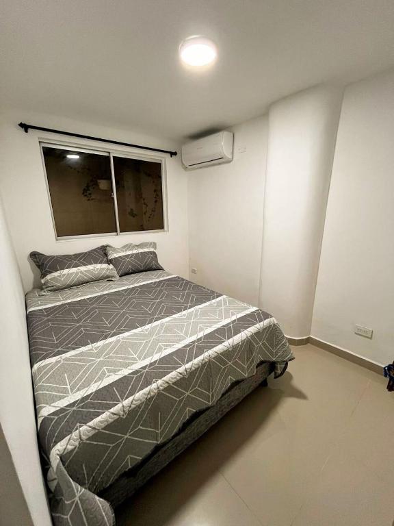 Postel nebo postele na pokoji v ubytování Acogedor y Moderno Apartamento en Barranquilla