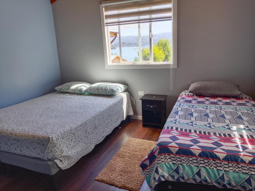 Postel nebo postele na pokoji v ubytování Cabaña nely