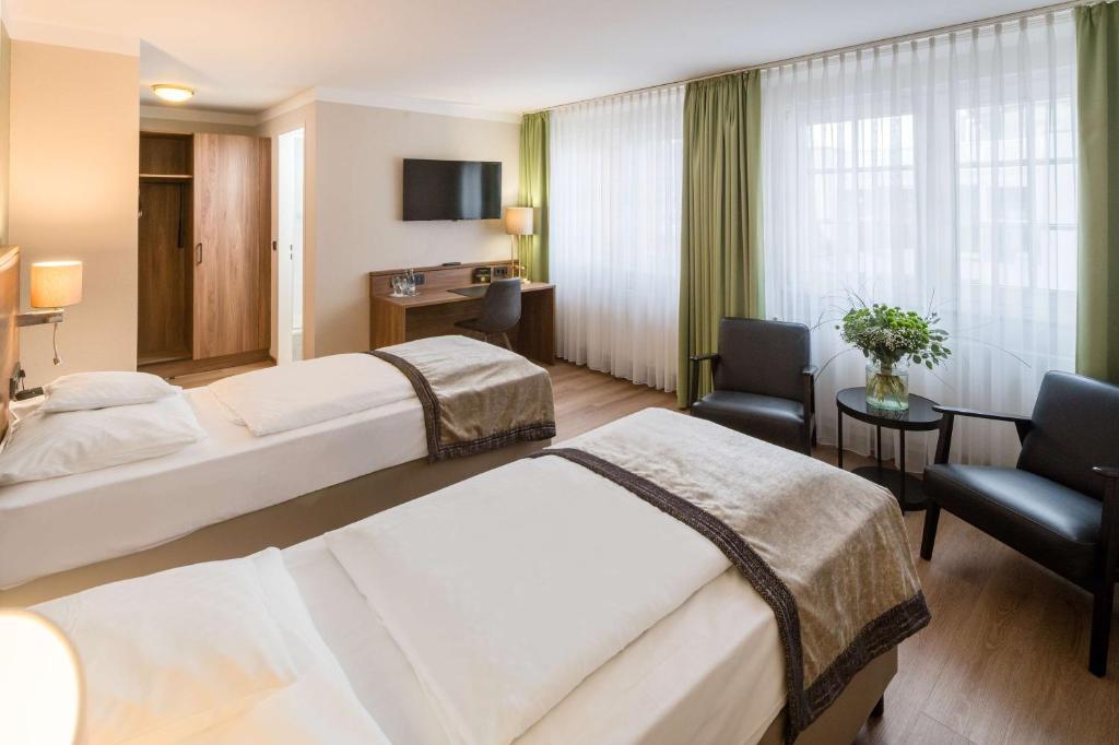Postel nebo postele na pokoji v ubytování Best Western Plus Hotel Excelsior
