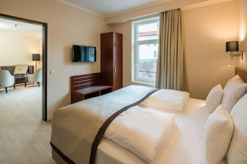 Postel nebo postele na pokoji v ubytování Best Western Plus Hotel Excelsior