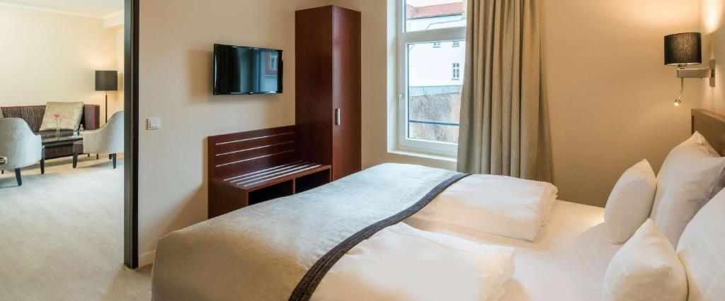 TV a/nebo společenská místnost v ubytování Best Western Plus Hotel Excelsior