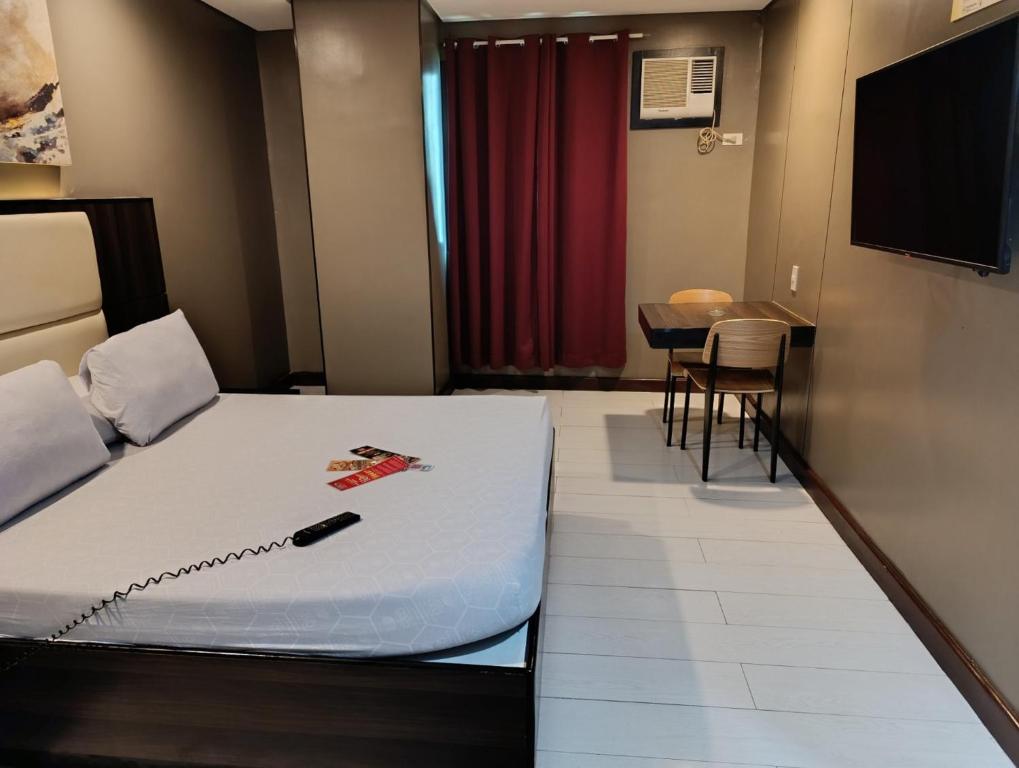 Postel nebo postele na pokoji v ubytování Hotel Sogo Quirino