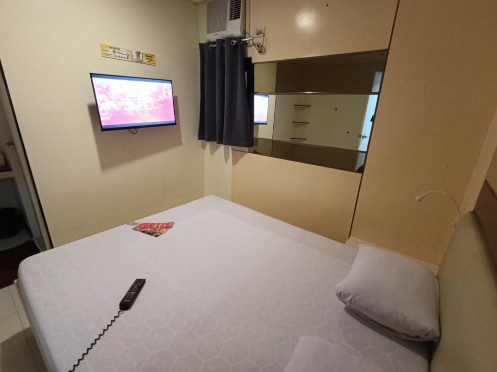 Postel nebo postele na pokoji v ubytování Hotel Sogo Quirino