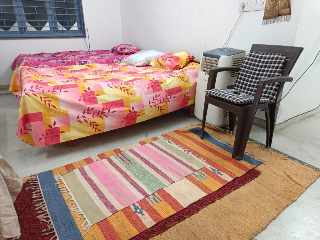 Postelja oz. postelje v sobi nastanitve Chintamani Siddhi Chakra - Only Family Rooms on Monthly Basis