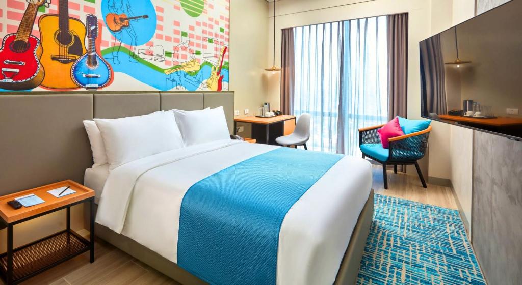 Postel nebo postele na pokoji v ubytování Belmont Hotel Mactan