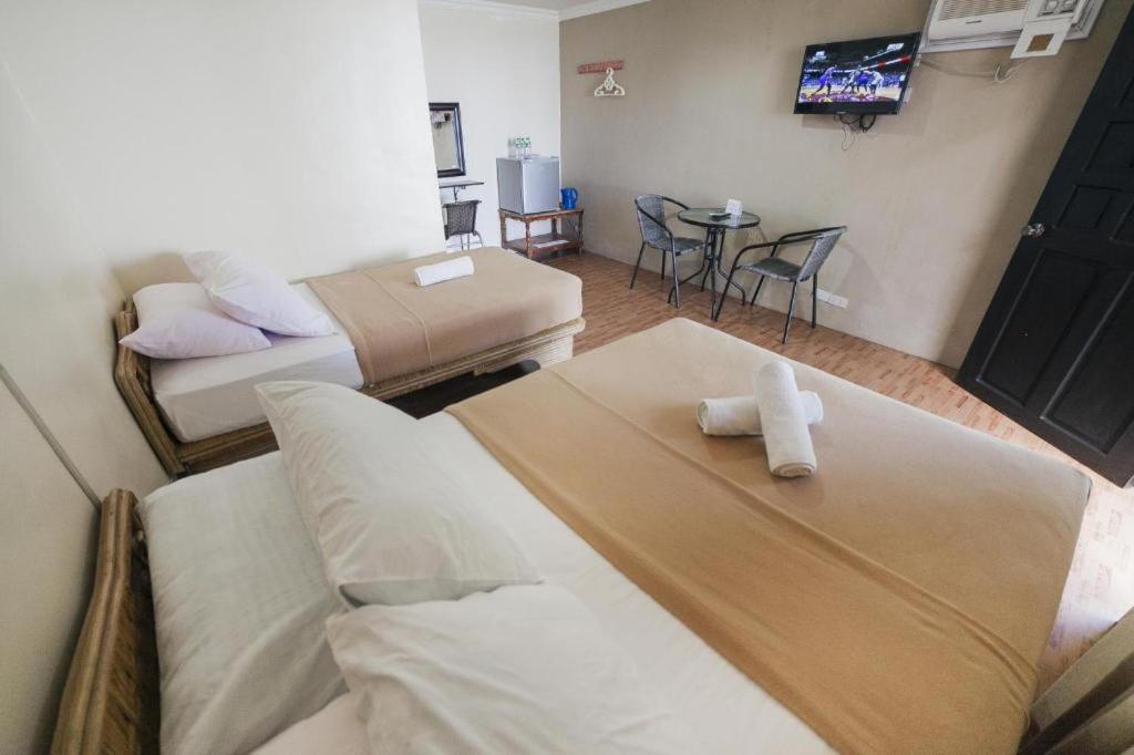 Postel nebo postele na pokoji v ubytování Panglao Grande Resort 邦劳美丽度假村