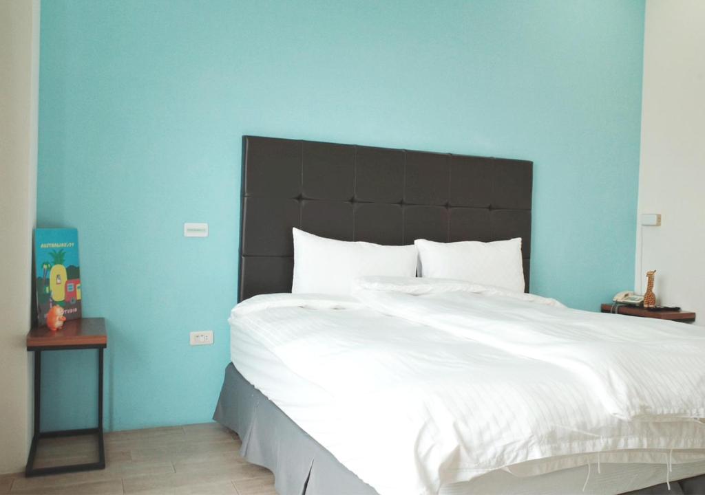 Postel nebo postele na pokoji v ubytování Happy Guesthouse