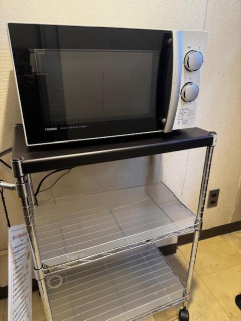 Kuchyň nebo kuchyňský kout v ubytování Bandai Silver Hotel