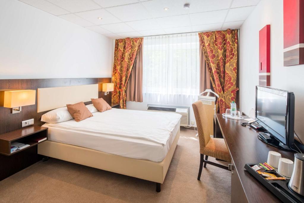 Postel nebo postele na pokoji v ubytování Best Western Hotel Jena