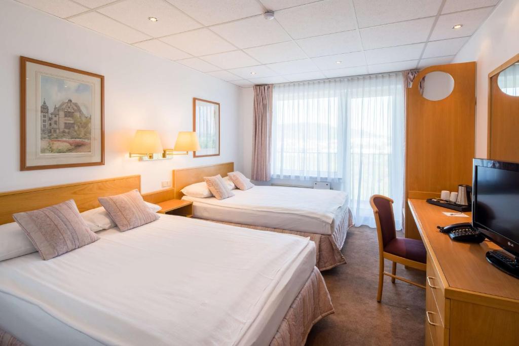 Postel nebo postele na pokoji v ubytování Best Western Hotel Jena