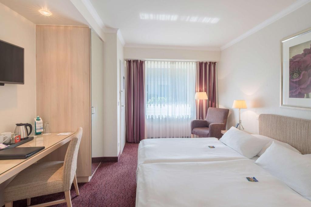 Postel nebo postele na pokoji v ubytování Best Western Hotel Hamburg International